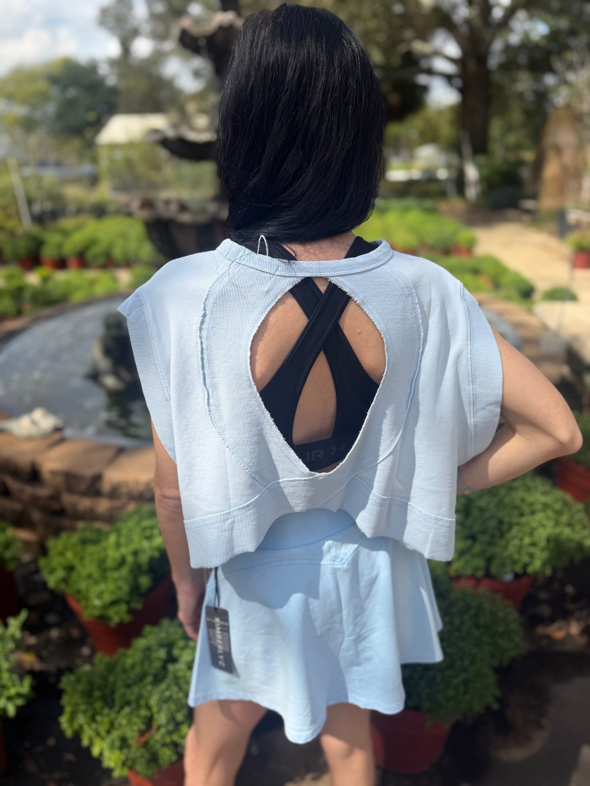 Light blue open back top.